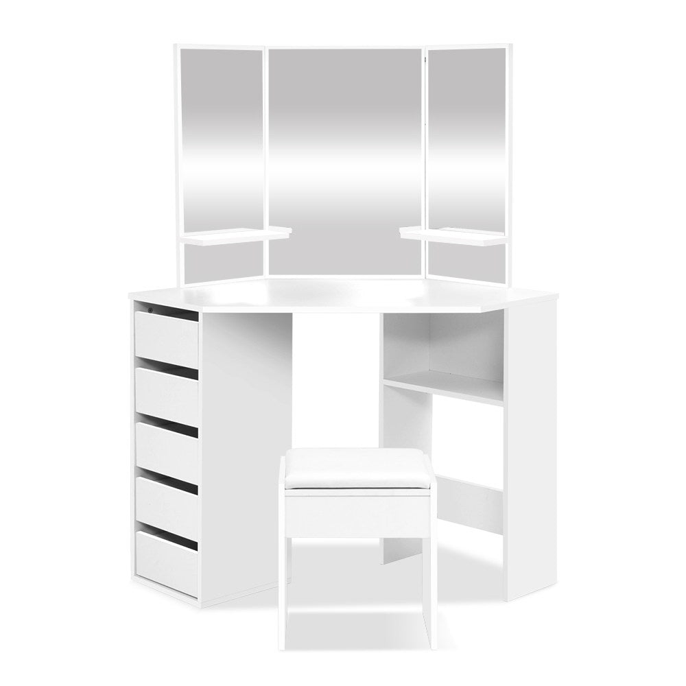 A modern white vanity with drawers and a mirror combines practicality with aesthetic appeal.